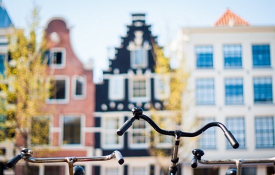 Beautiful canal houses and a bike in Amsterdam, Holland